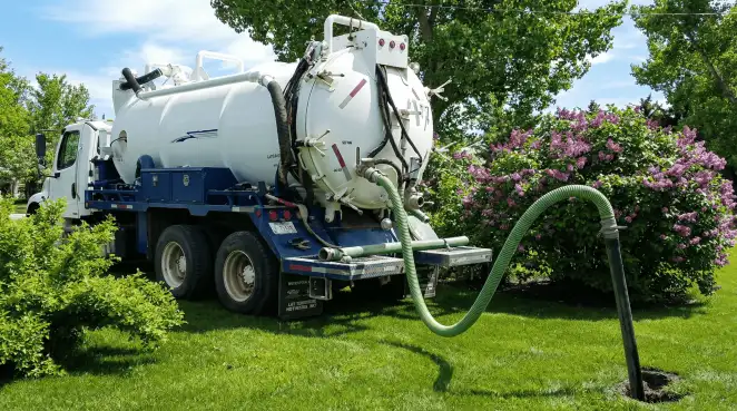 Professional vacuum truck performing residential drainage and septic maintenance in Detroit, MI